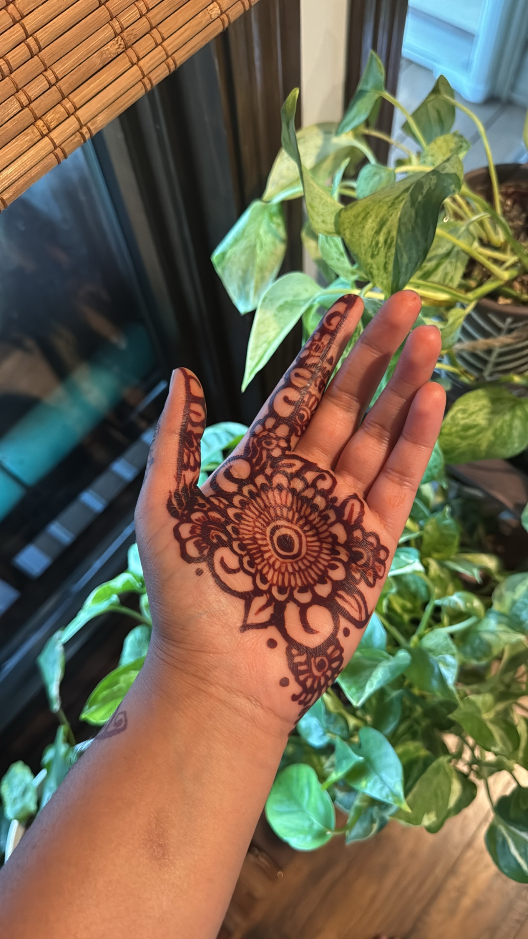 Detailed palm henna with central mandala motif