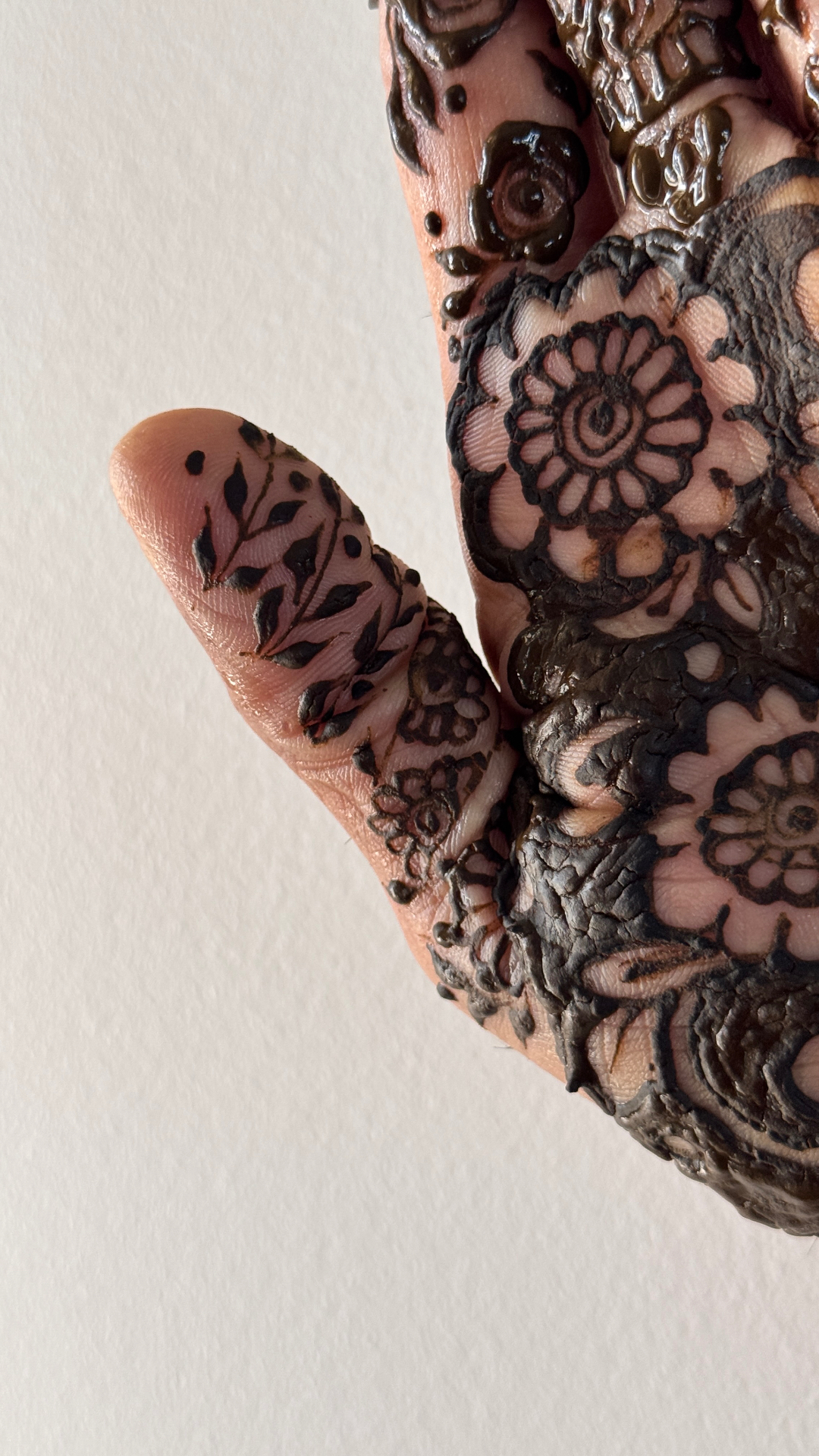 Delicate hand henna with leaf patterns and mandala elements