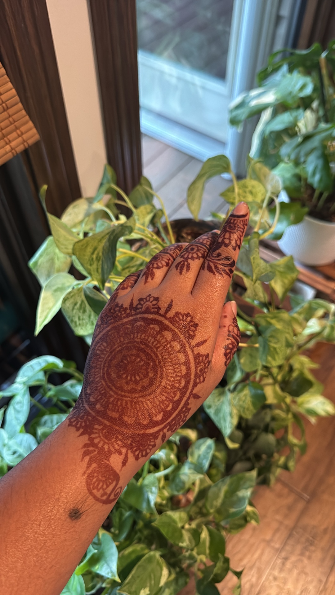 Elegant hand and arm henna with flowing patterns