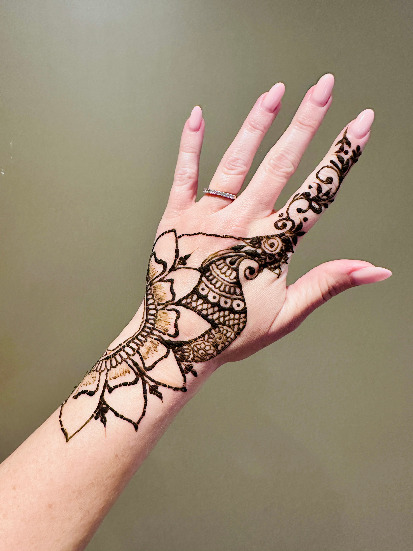 Contemporary hand henna with paisley and mandala elements