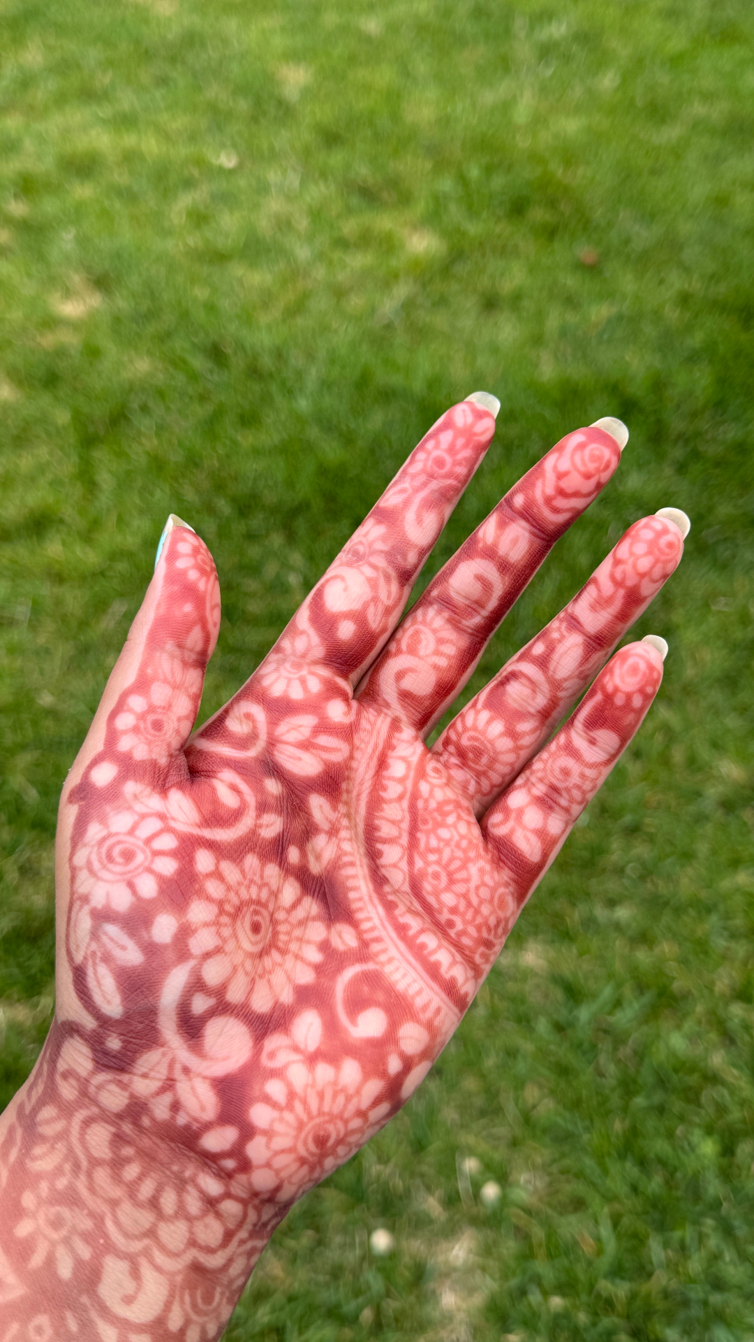 Intricate white henna design with mandala patterns